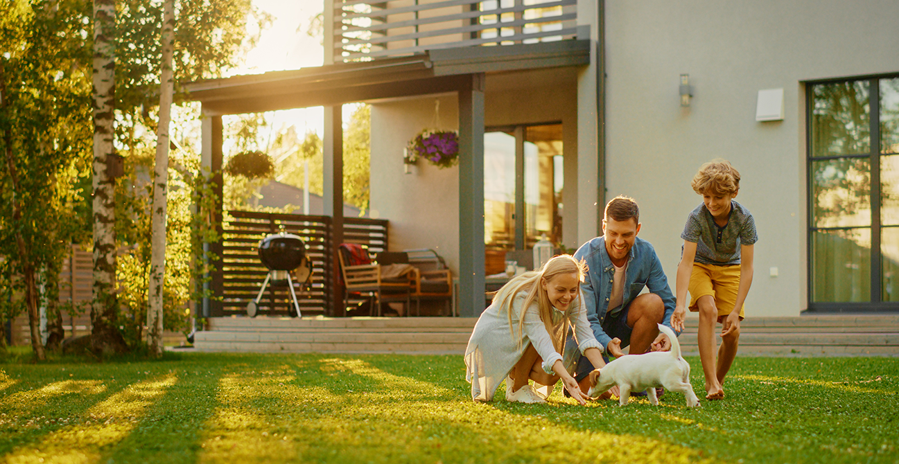 Family Playing in their Backyard with Dog